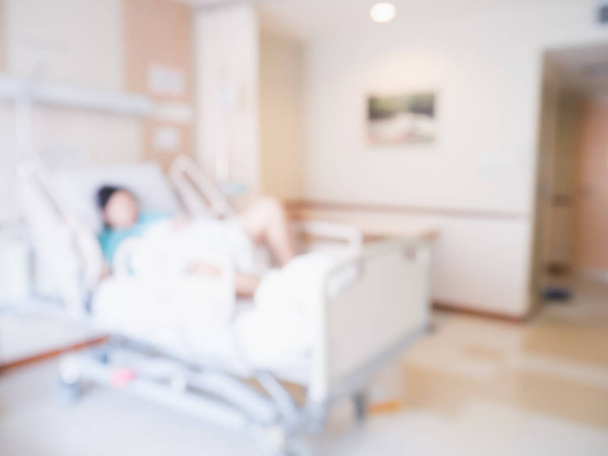 Desenfoque abstracto Paciente en cama en el interior de la habitación del hospital para el fondo - Foto, Imagen