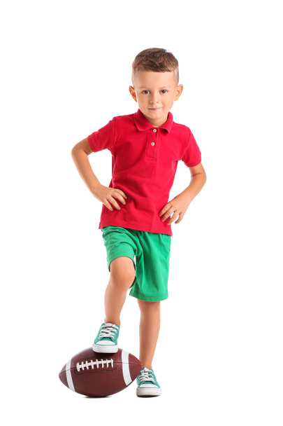 Мальчик с мячом для регби на белом фоне - Фото, изображение