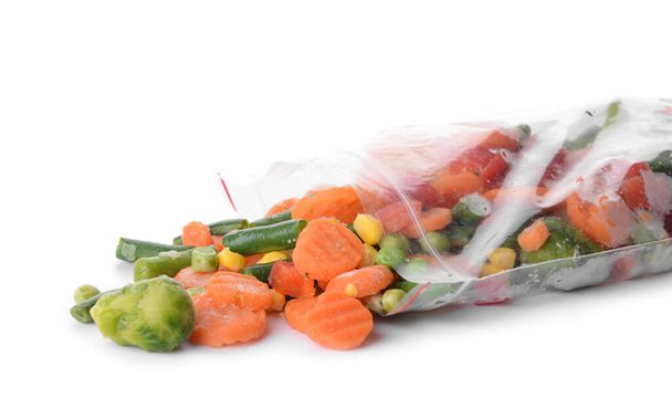 Bag with mix of frozen vegetables on white background - Фото, изображение