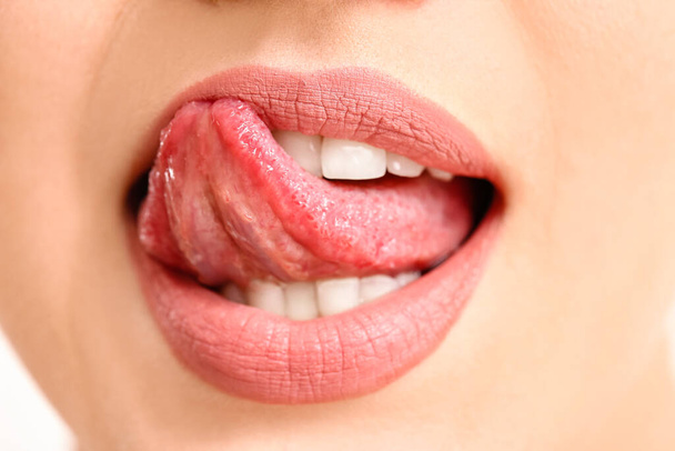 Beautiful young woman with pink lips, closeup - Photo, Image