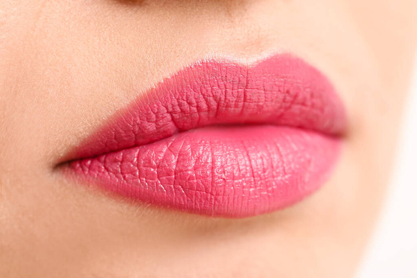 Beautiful young woman with bright lips, closeup - Фото, изображение
