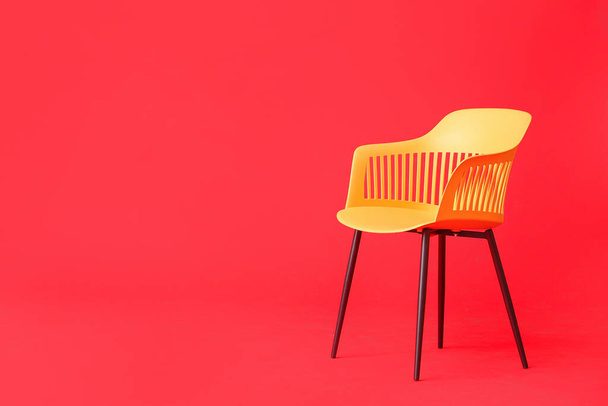 Modern chair on color background - Foto, imagen