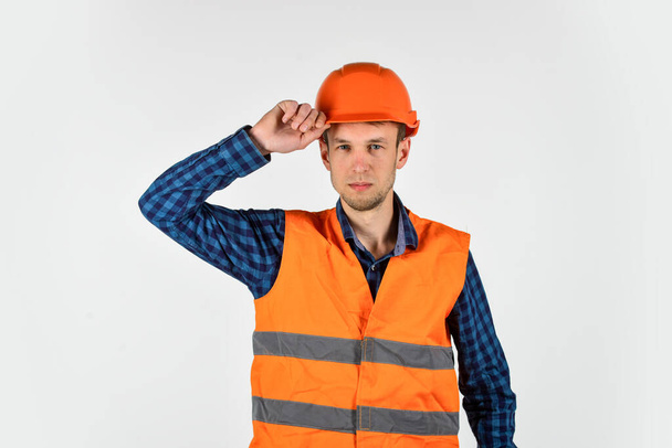 man on construction site engineer. real construction worker in helmet. carpenter ready to work. repair concept. young worker is engineer assistant. repairman in uniform - Фото, зображення