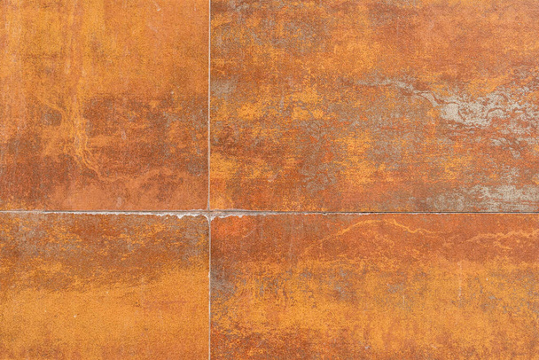 Rusty background texture with seams. Tiled stained rusty wall - Photo, Image
