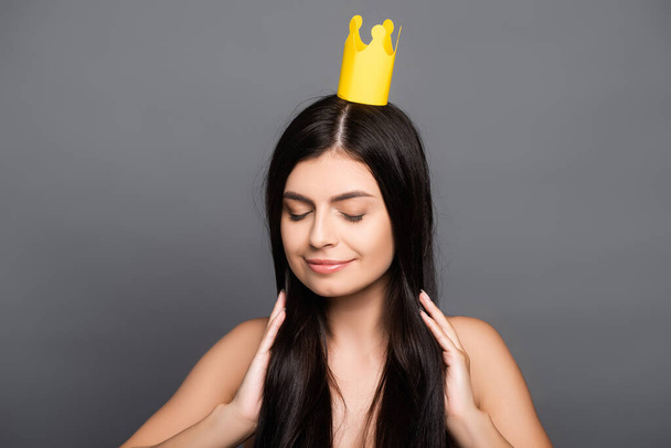 naked brunette long haired woman in crown isolated on black - Photo, Image