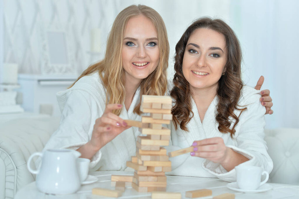  women playing with  blocks  - Zdjęcie, obraz