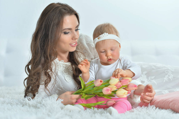 young woman playing with little daughter - Foto, Imagem