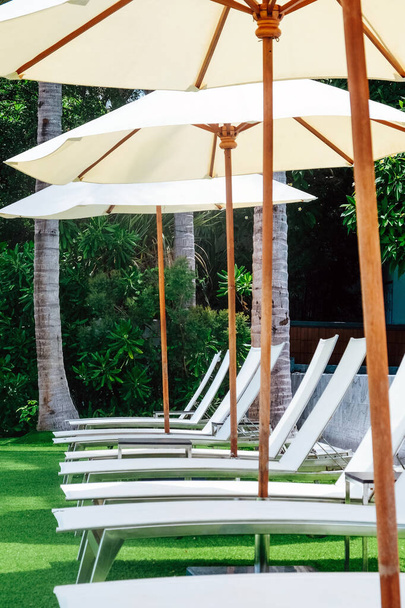Image of Chaise longue at the pool in tropical resort - Foto, Bild