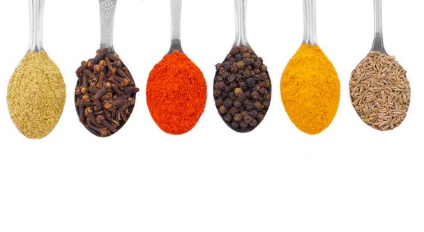 Indian Spices in Spoons Also Know as Red Chilli Powder, Black Pepper, Turmeric Powder, Coriander Powder, Cumin, Cloves, Mirchi, Mirch, Laal Mirchi, Haldi, Dhaniya Powder, Jeera, Kali Mirch or Lavang. - Photo, Image