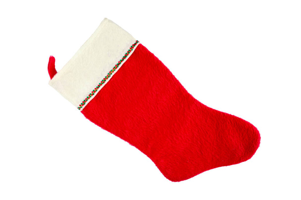 red and white christmas sock on isolated background. High quality photo - Photo, Image