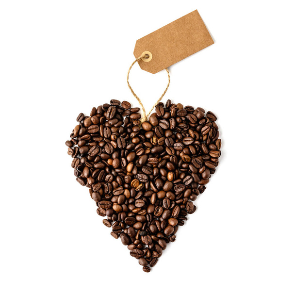 Coffee beans in shape of heart on white background, flat lay - Фото, зображення