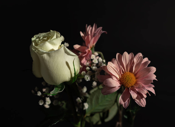 A closeup shot of a beautiful bouquet on a black background - perfect for wallpaper - Фото, изображение