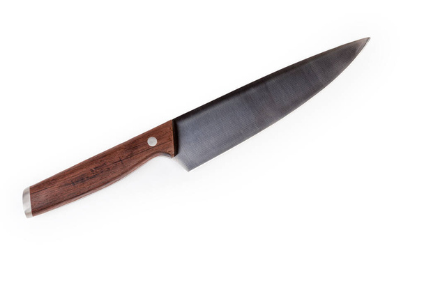 Kuchyně z nerezové oceli velký kuchařský nůž položen na bílém pozadí, horní pohled - Fotografie, Obrázek