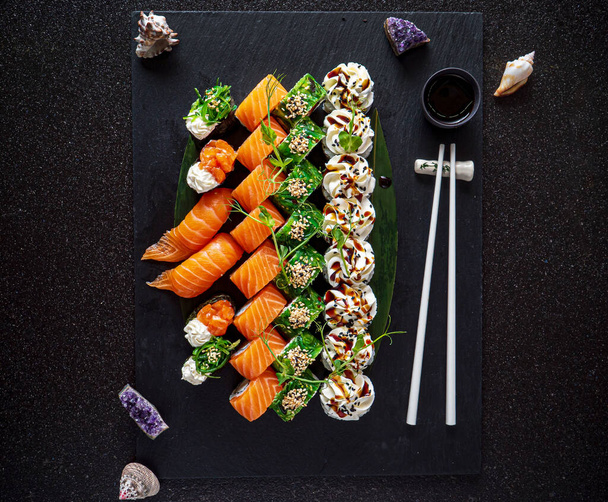 sushi on the black background - Foto, Imagen