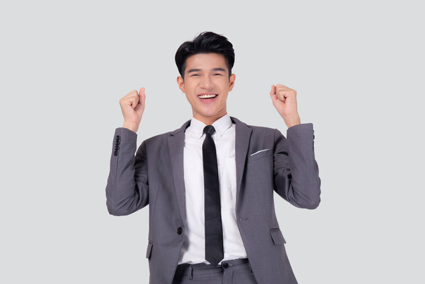 Portrait businessman in suit standing with win success isolated on white background, young asian business man is manager or executive having confident and excited is positive, expression and emotion. - Foto, Imagem