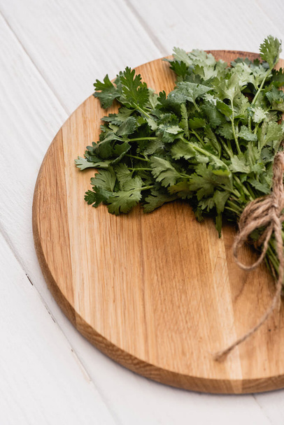 green parsley on wooden board on white background - Foto, immagini
