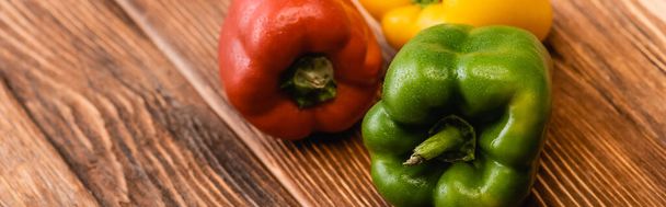 colorful ripe bell peppers on wooden table, panoramic shot - Φωτογραφία, εικόνα