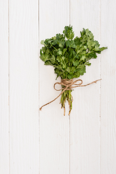 top view of parsley on white wooden table - Φωτογραφία, εικόνα