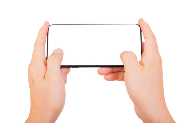 One Hand holding new smartphone on over white background. Smartphone isolate. - Φωτογραφία, εικόνα