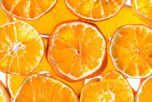 Background from slices of dried orange fruit - Fotografie, Obrázek