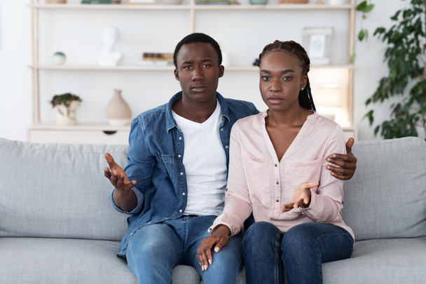 Frustrated Black Couple Sitting On Couch At Family Counselors Office, Suffering Misunderstanding - Photo, Image