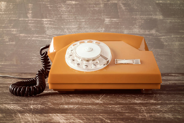 Old vintage classic telephone on wooden table - Foto, Bild