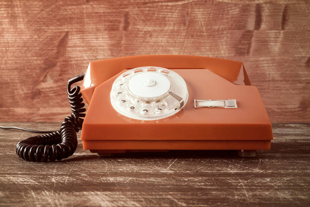 Old vintage classic telephone on wooden table - Fotografie, Obrázek