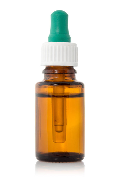 Brown medicine glass bottle with dropper isolated over white - Valokuva, kuva