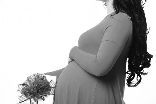 female hands of pregnant woman holding present or gift - Foto, Imagem