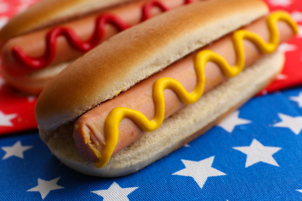 Tasty hot dogs on napkin with stars - Фото, изображение