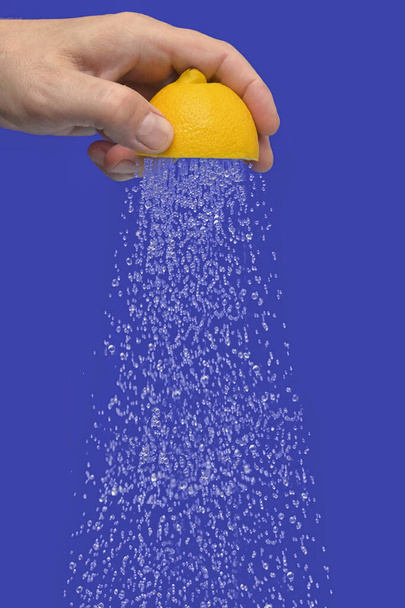 Conceptual Water Flowing Shower From Squeeze Half Of A Lemon - Photo, Image