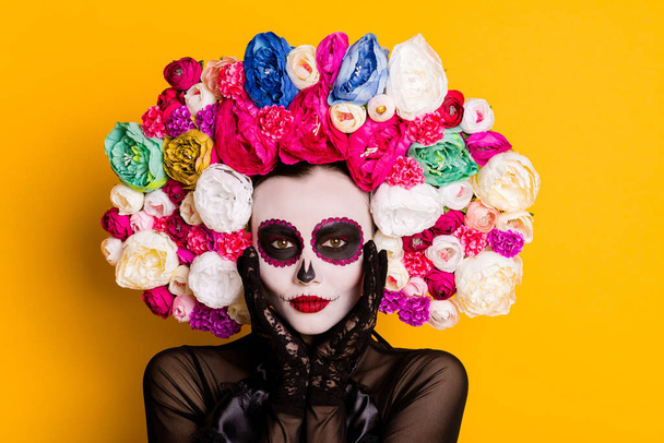 Close-up portrait of her she nice glamorous beautiful lady Santa Muerte touching white face makeover body art voodoo isolated bright vivid shine vibrant yellow color background - 写真・画像