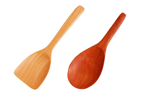 Wooden ladle and wooden spatula isolated on white background. Concept of reducing the use of plastic containers has turned to environmental protection containers. - Photo, Image
