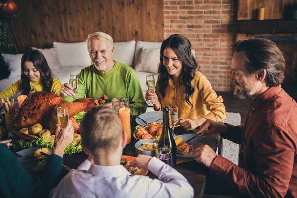 Portrait of nice attractive adorable cheerful family small little kids meeting eating domestic tasty yummy dishes turkey harvest celebration drinking wine modern loft industrial brick interior house - Foto, immagini