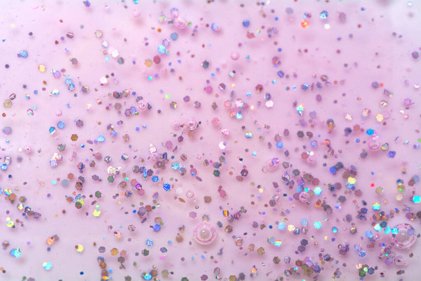 Texture di gel rosa con scintille. Texture glitter con paillettes. Gel smalto per unghie. - Foto, immagini