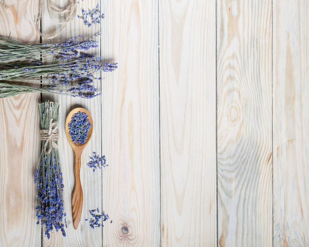 Bunch of dried lavender on wooden background. Top view, copyspace. - Foto, Imagen
