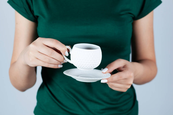 woman hand holding cup of coffee or tea  - Φωτογραφία, εικόνα
