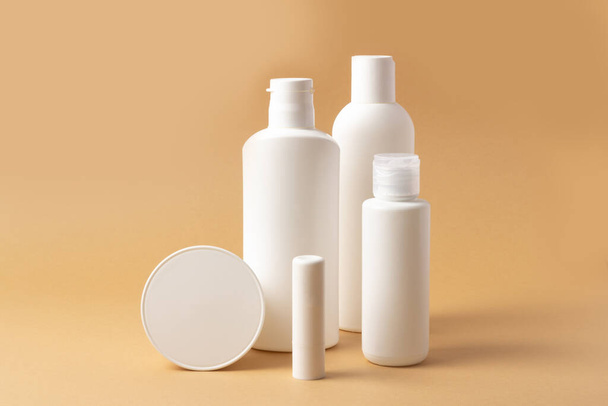 Set of white cosmetic bottles and jars with place to add text - Fotó, kép