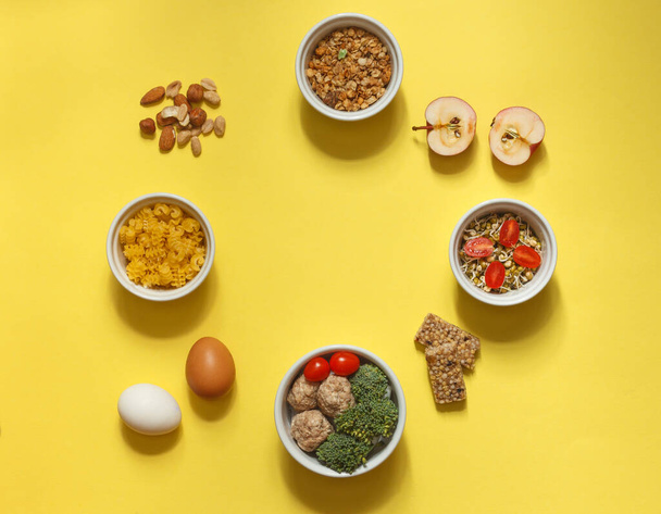 A full-day meal option, including Breakfast, lunch, snacks, and dinner. Layout on a pink background, top view, horizontal - Photo, Image