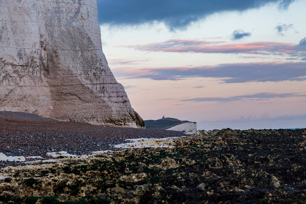 Low tide on the Sussex Coast, with a view of chalk cliffs at sunset - Fotó, kép