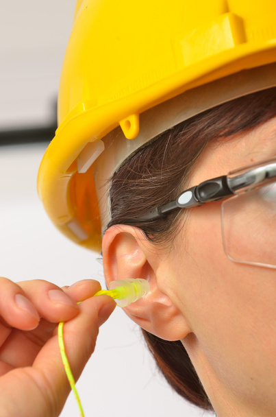Woman with protective ear plugs - Photo, Image