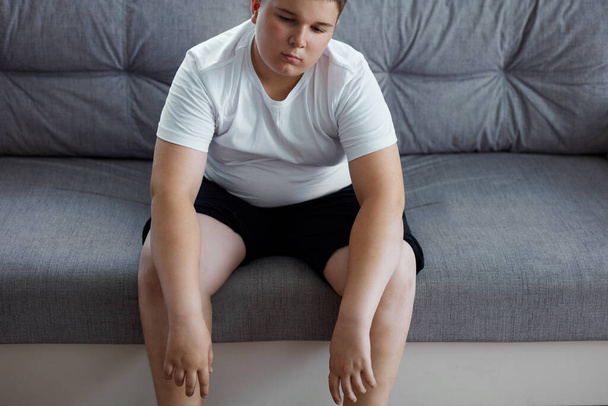 sleepy teenager boy sit alone at home - Foto, Imagem