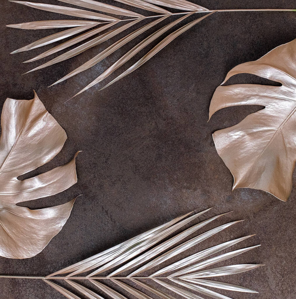 Golden palm leaves on the marble background. High quality photo. - Valokuva, kuva