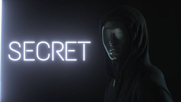 Man wearing black mask and the light revealing SECRET word - Fotó, kép