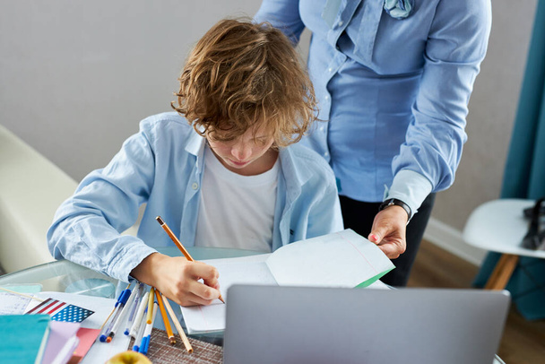 math teacher teach young teen boy at home - Foto, imagen
