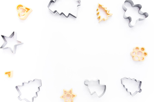 Christmas baking molds on white background. Flat lay, top view bakery composition. - Foto, immagini