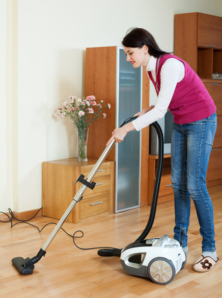 woman cleaning with vacuum cleaner - Zdjęcie, obraz
