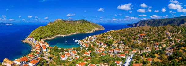 Aerial drone view video of beautiful and picturesque colorful traditional fishing village of Assos in island of Cefalonia, Ionian, Greece. Peninsula of Assos in Cephalonia (Kefalonia), Greece - Photo, Image