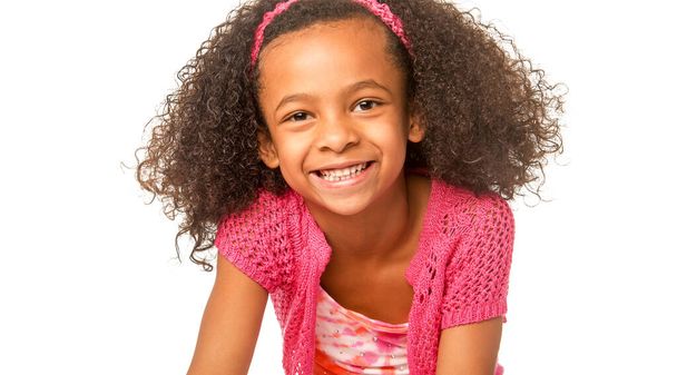 Smiling happy little girl with beautiful curly frizzy hair - Foto, Bild
