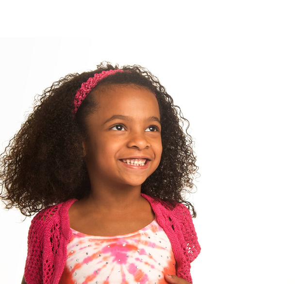Smiling happy little girl with beautiful curly frizzy hair - Fotoğraf, Görsel